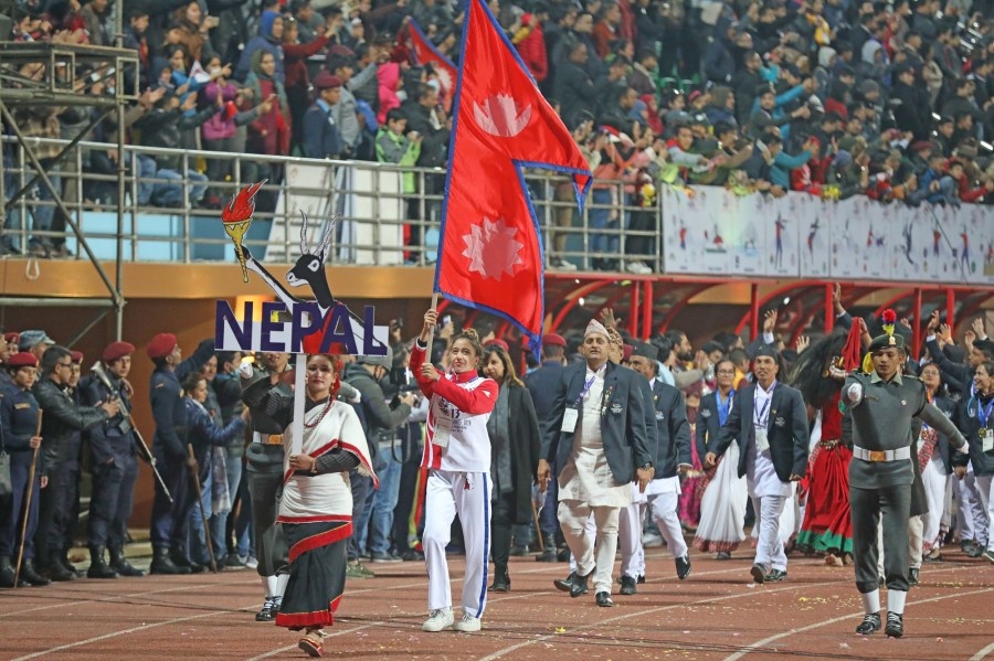 Nepalese swimmer Gaurika Singh, who wn four gold medals in the pool, leads the host-nation contingent at the march past at the Closing Ceremony at Dasharath Stadium on Tuesday. © Kathmandu Post
